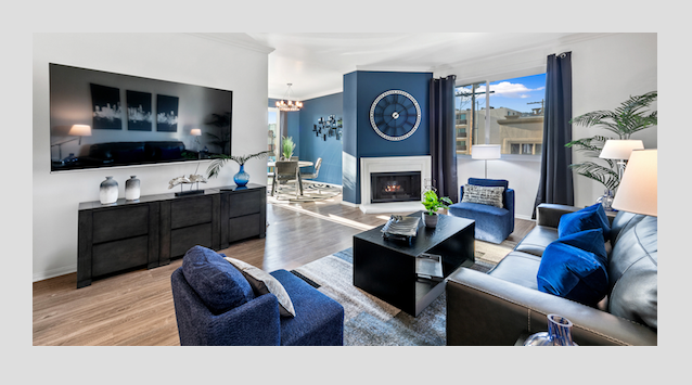 Modern living room with bold blue and black accents