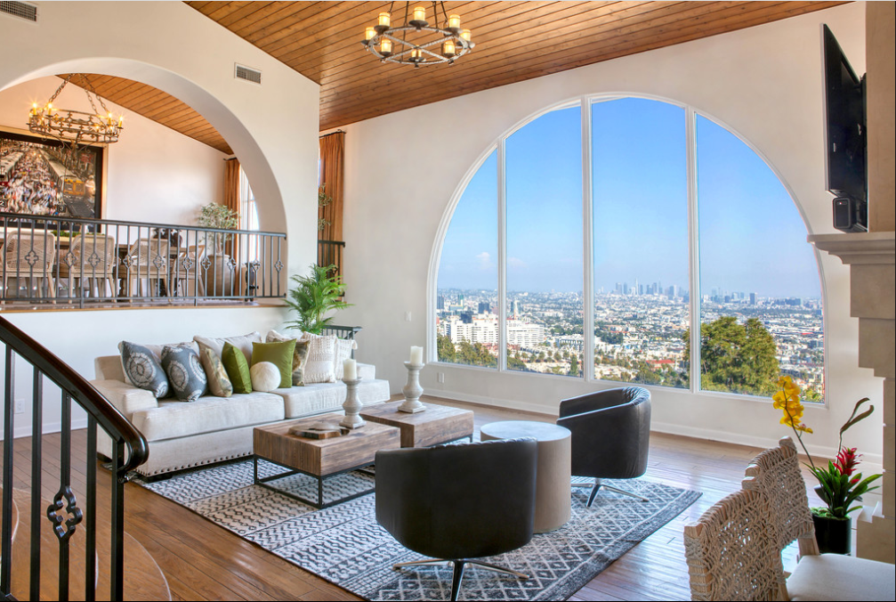 Luxury penthouse living room with sweeping city skyline views