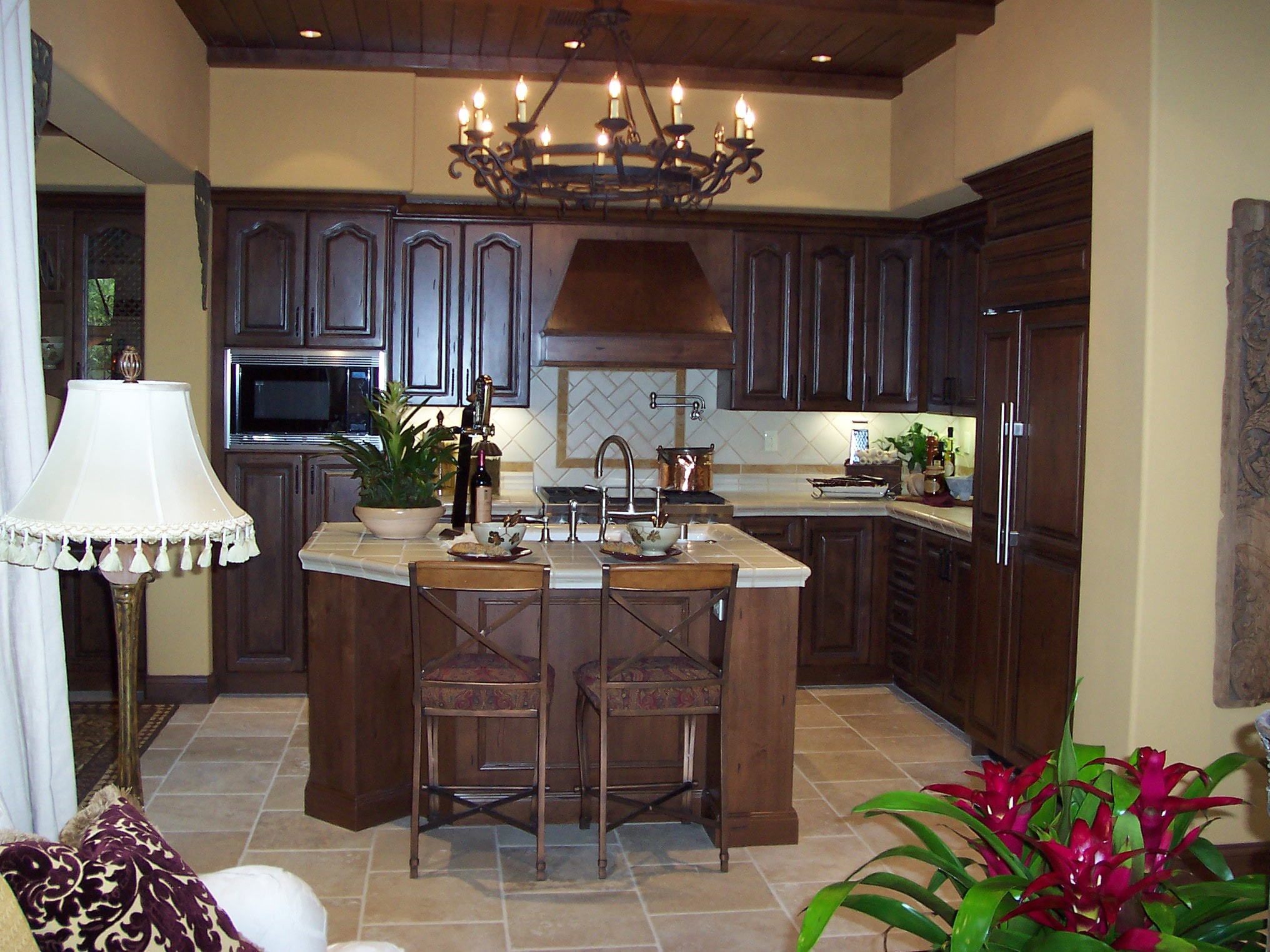 Traditional kitchen with dark wood cabinetry and central island