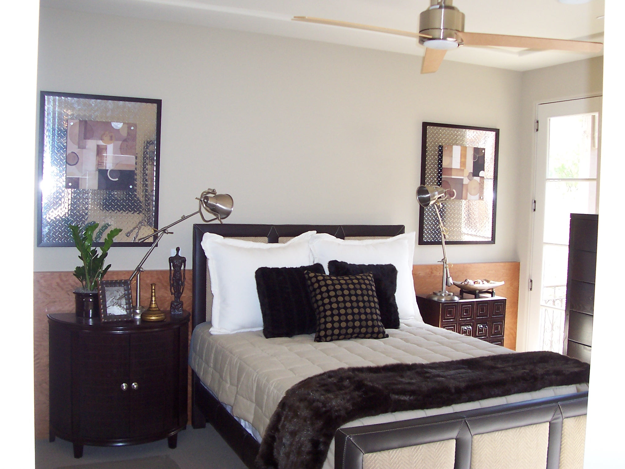 Black and white primary bedroom with contemporary furnishings